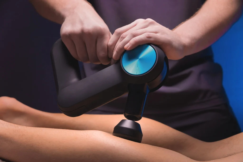 Therapist applying sports massage therapy to a patient's foot sports physiotherapist Birmingham