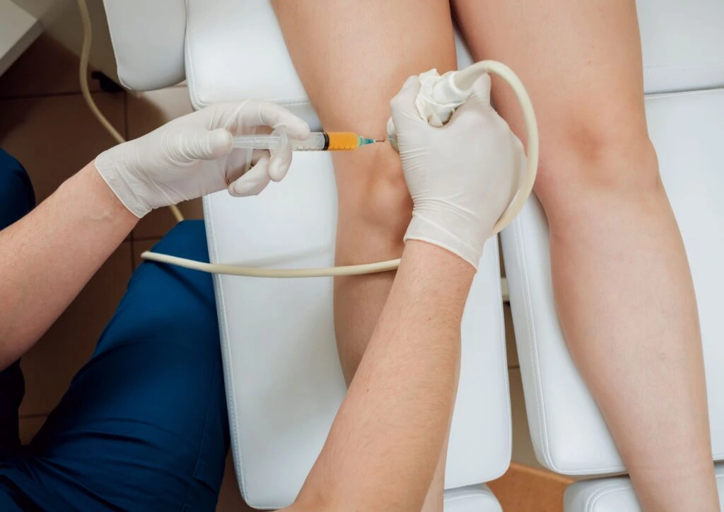 Physician performing an ultrasound-guided PRP therapy procedure on targeted tissue ultrasound guided injection near me ultrasound guided injection Birmingham